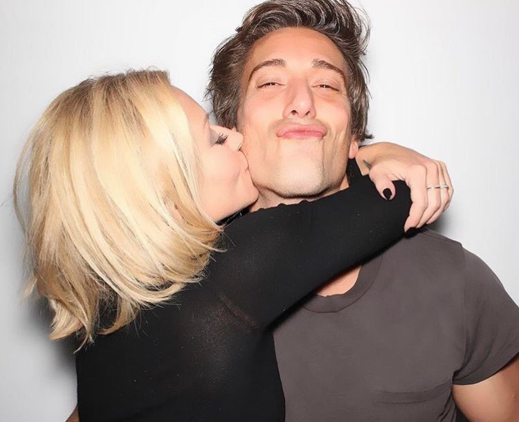 Kelly Ripa wearing black inner and David wearing grey vest.